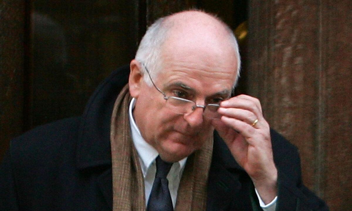 Sir Richard Dearlove, former head of MI6, leaves the High Court after giving testimony in an inquest in London, on Feb. 20, 2008. (Cate Gillon/Getty Images)