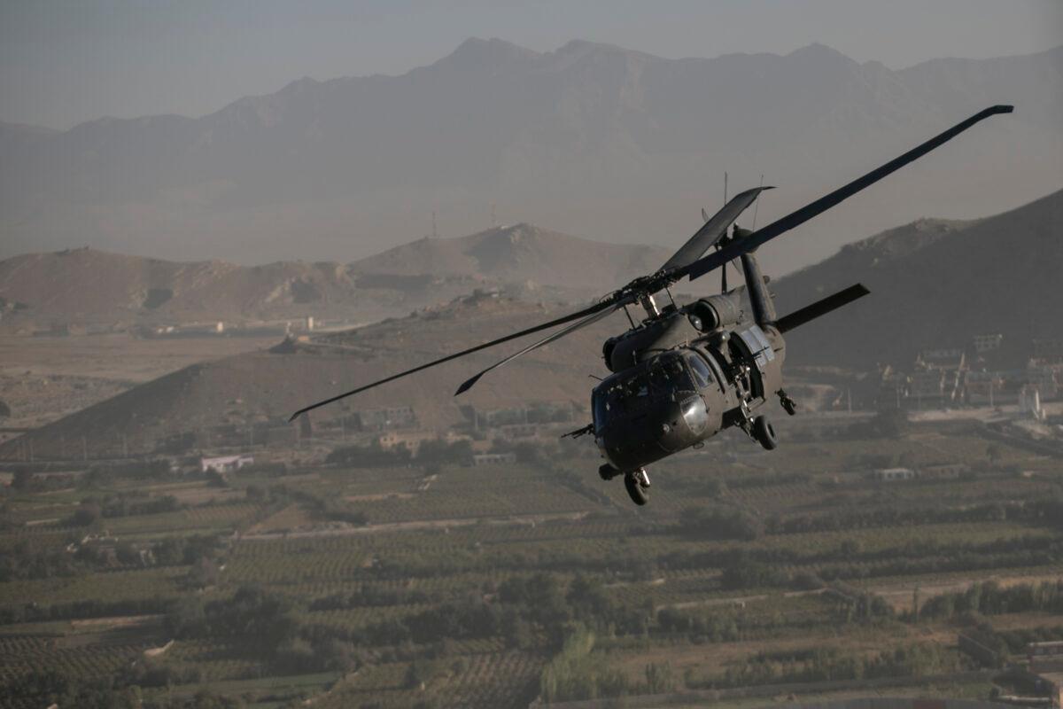 Undated photo showing a Black Hawk helicopter over Kabul, Afghanistan. (Dan Kitwood/AP)