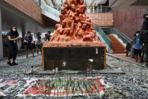 Flowers before the Pillar of Shame in Hong Kong on June 4, 2021. (Sung Pi-lung/The Epoch Times)