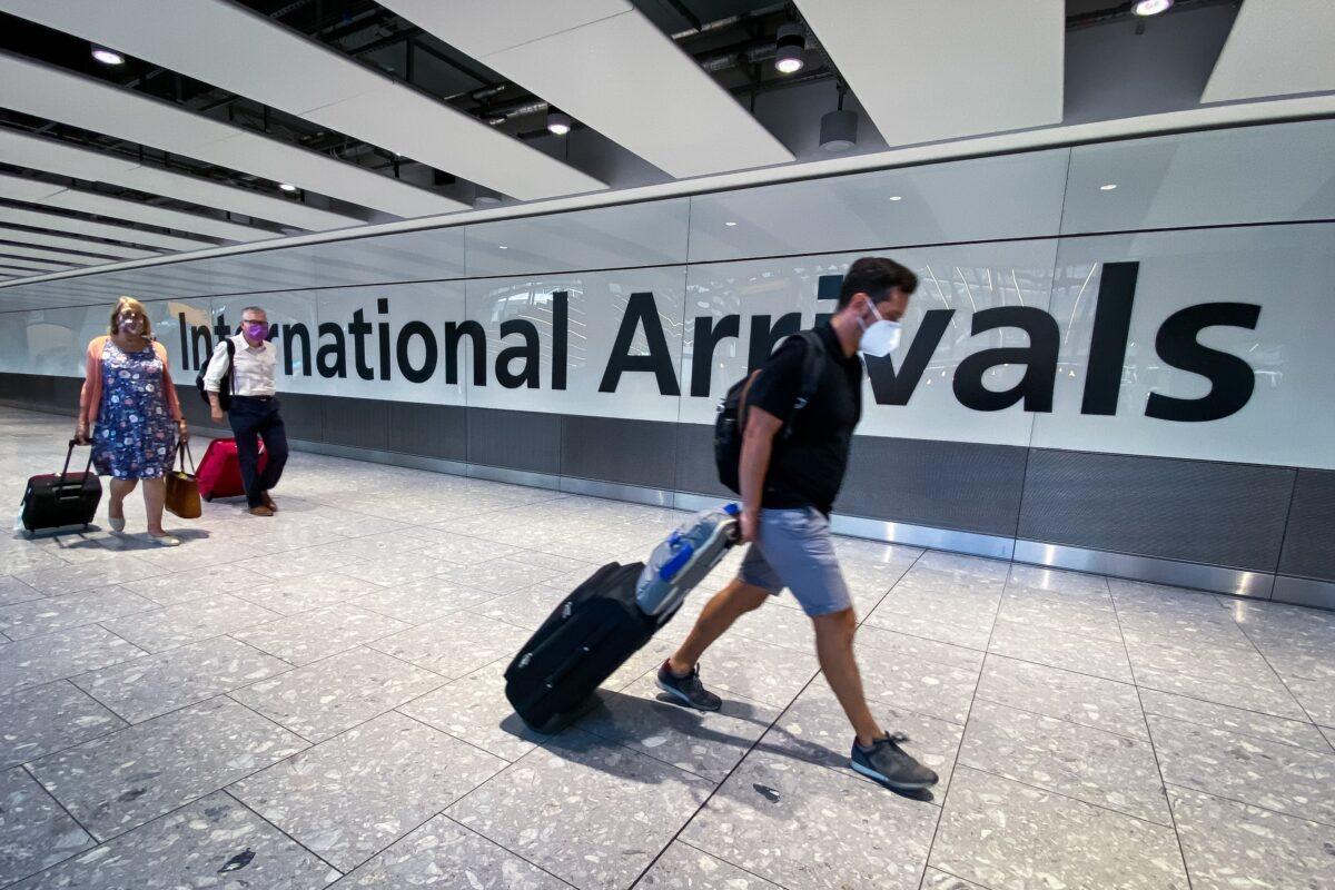 Passengers in the arrivals hall at Heathrow Airport, London, on Aug 22, 2020. (Aaron Chown/PA)