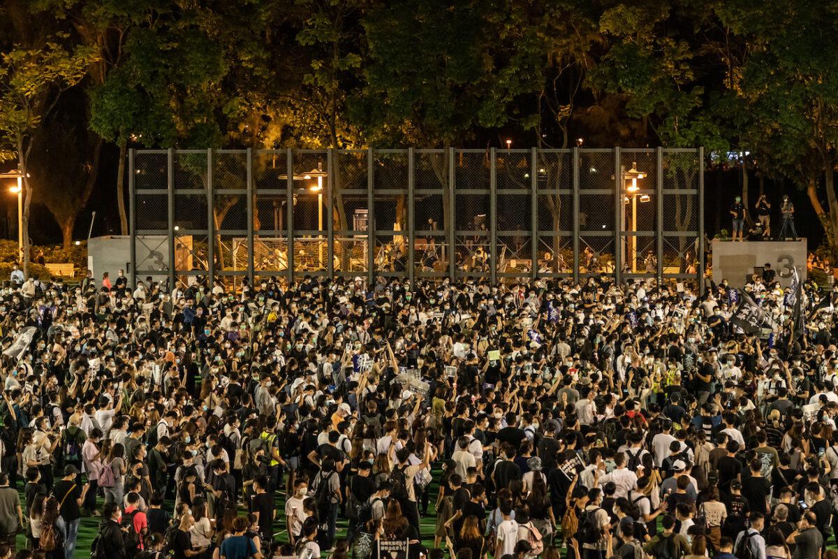 Participants hold candles as they take part in a memorial vigil in Victoria Park in Hong Kong on June 4, 2020. (Anthony Kwan/Getty Images)