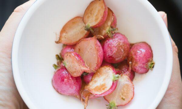 Lightly roasting radishes preserves their crunch while taking some edge off their fiery essence. (Ina Ts/shutterstock)