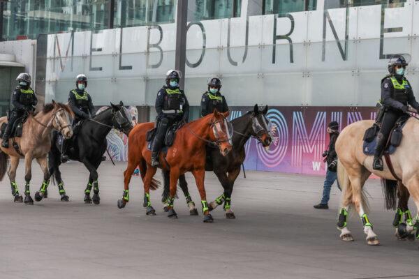 Police mounted on horseback are seen on patrol near the Royal Exhibition building, awaiting a planned protest on June 5, 2021, in Melbourne, Australia. (Asanka Ratnayake/Getty Images)