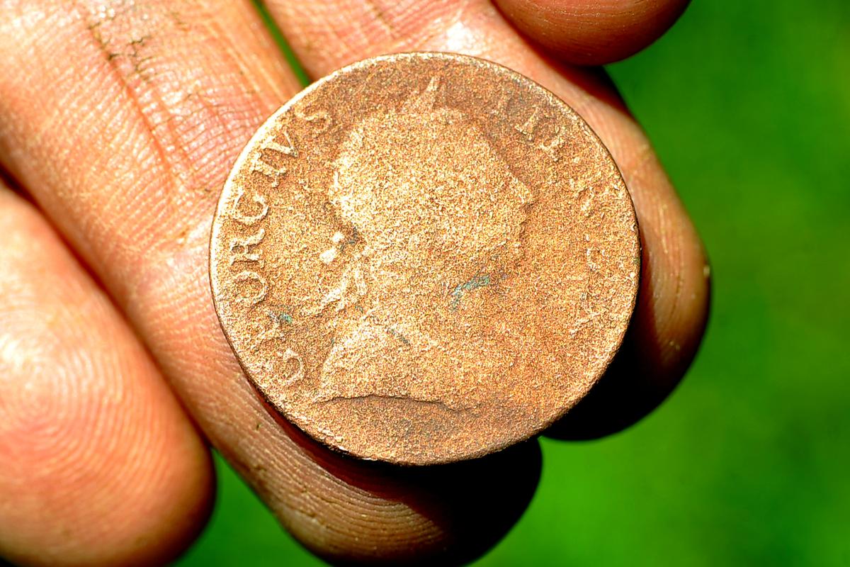 The George IV 1775 halfpenny Atkinson's son's dog Lucky dug up. (SWNS)