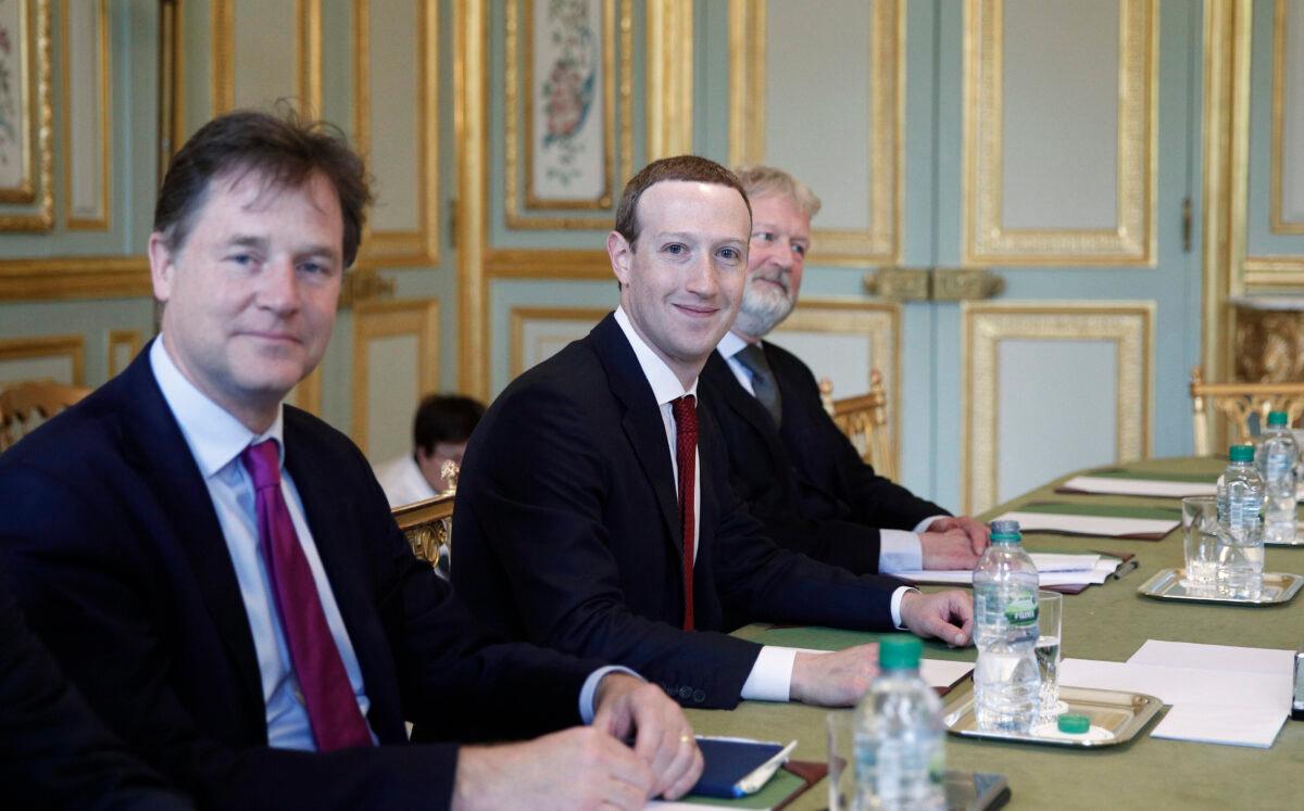 CEO and co-founder of Facebook Mark Zuckerberg poses next to Facebook head of global policy communications and former UK deputy prime minister Nick Clegg (L) prior to a meeting with French President at the Elysee Palace in Paris on May 10, 2019. (Yoan Valat/AFP via Getty Images)