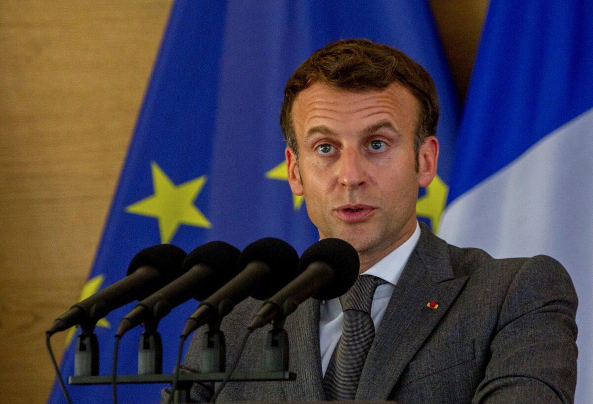 French President Emmanuel Macron speaks as he attends a joint news conference with Rwandan President Paul Kagame at the Presidential Palace in Kigali, Rwanda, on May 27, 2021. (Jean Bizimana/Reuters)