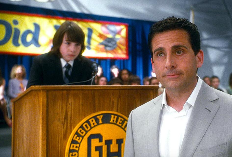 Salutatorian Robbie (Jonah Bobo, L), son of Cal (Steve Carell), is interrupted by dad in the middle of his incredibly depressing graduation speech about how worthless love is, in "Crazy, Stupid, Love.” (Warner Bros.)
