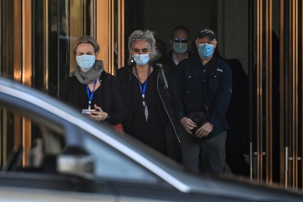 (L-R) Thea Fischer, Marion Koopmans, Peter Daszak, and other members of the World Health Organization (WHO) team investigating the origins of the COVID-19 pandemic, leave the Hilton Wuhan Optics Valley Hotel in Wuhan, China, on Jan. 29, 2021. (Hector Retamal/AFP via Getty Images)