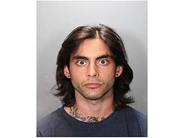 This undated photo provided by the Orange County District Attorney's Office shows Marcus Anthony Eriz, 24, was arrested in connection with a road rage shooting that killed a 6-year-old boy last month on a Southern California freeway. (Orange County District Attorney's Office via AP)
