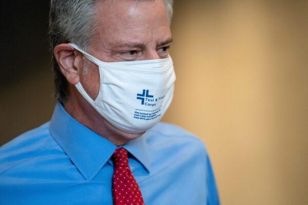New York Mayor Bill de Blasio takes a facility tour before a ribbon-cutting ceremony to mark the opening of a Nanotronics manufacturing center at the Brooklyn Navy Yard, in the Brooklyn borough of New York City, on April 28, 2021. (John Minchillo/Pool via Reuters)