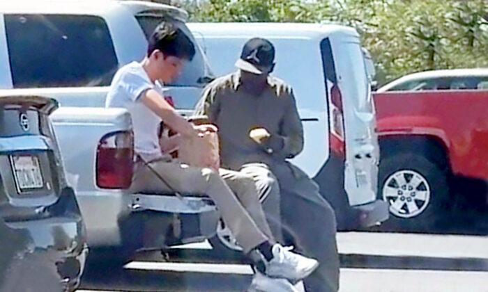 Touching Video Shows Teen Buying Homeless Man Lunch at Taco Bell, Joining Him for Meal