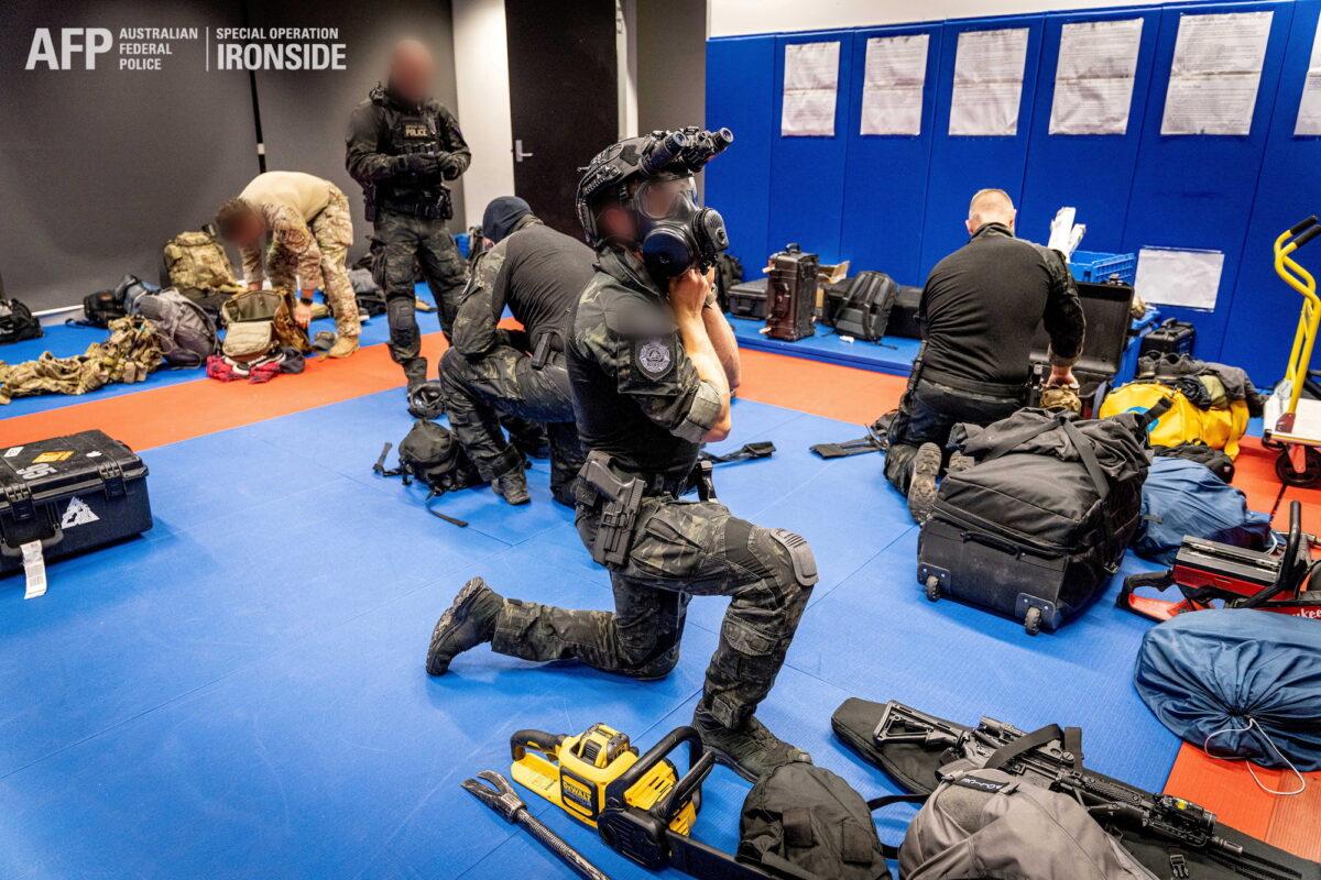 Australian Federal Police are seen during an operation against organized crime in this undated handout photo released June 8, 2021. (Australian Federal Police/Handout via Reuters)