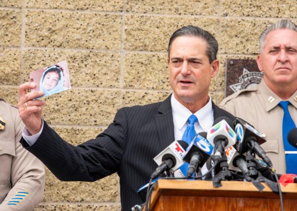 Orange County District Attorney Todd Spitzer holds up a photo of Aiden Leos during a news conference outside the CHP office in Santa Ana, to update on the investigation into the shooting death of six-year-old Aiden Leos, in Calif., on June 7, 2021. (Leonard Ortiz/The Orange County Register via AP)