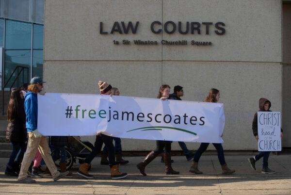 Supporters rally outside court as Pastor James Coates, of GraceLife Church, is in court to appeal bail conditions, after he was arrested for holding day services in violation of COVID-19 rules in Edmonton, on March 4, 2021. (Jason Franson/The Canadian Press)