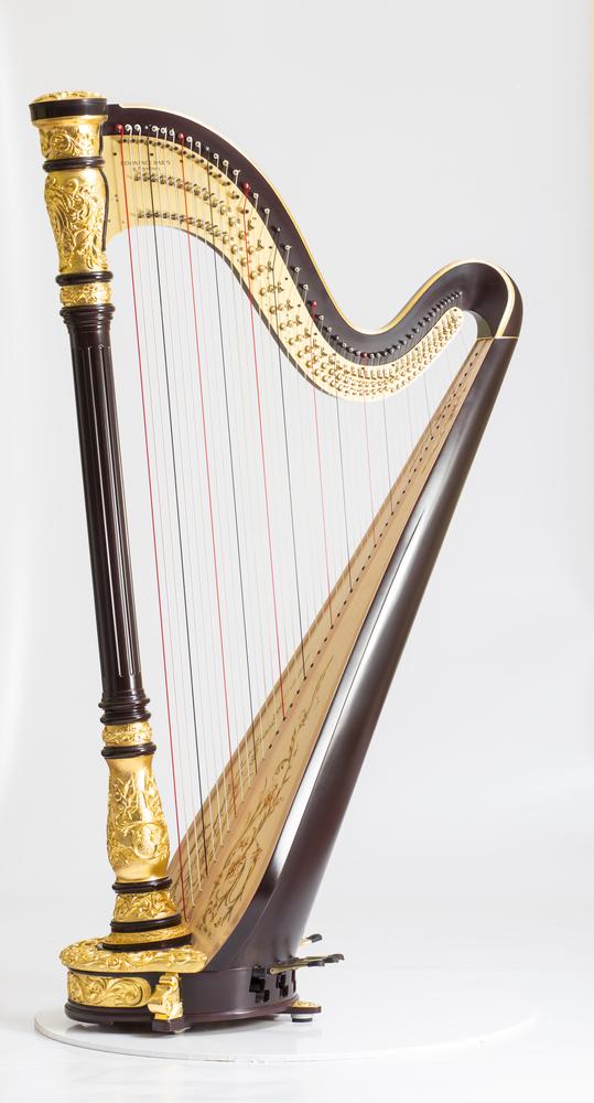 A beautiful classical harp with pedals visible at its base. (Peter Voronov/Shutterstock)