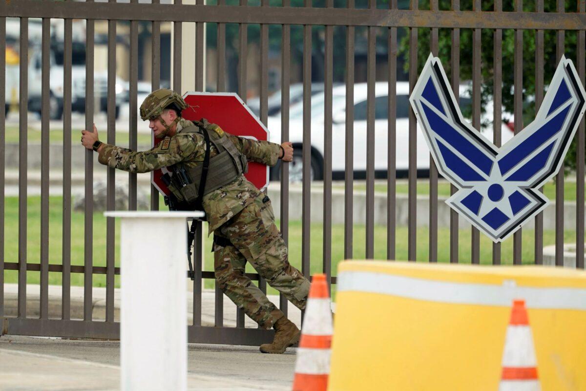 A military policeman closes a gate at JBSA-Lackland Air Force Base gate in San Antonio, Texas, on June 9, 2021. (Eric Gay/AP Photo)