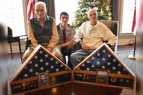 Veteran Bill Hadden (L) and career Air Force Veteran Paul Infeld (R) were presented with shadow boxes housing replaced medals and awards as part of the Hero’s Bridge Honor Guard program. Warrenton, Va., Eagle Scout Bryce Brooks (C) took part in the event. (Courtesy of Hero's Bridge)