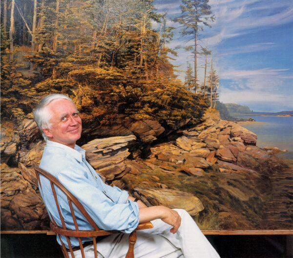 Realist artist Joel Babb seated in front of one of his paintings. (Amazeen)