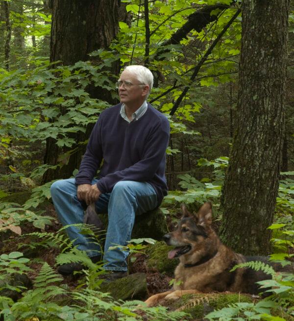 Realist artist Joel Babb and his dog Ruskin in the woods. (Courtesy of Joel Babb)