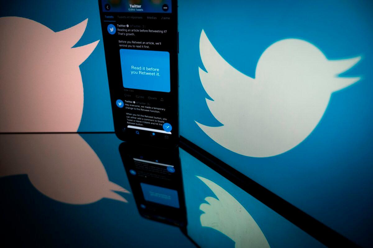 The logo of Twitter is displayed on the screen of a smartphone and a tablet in Toulouse, France, on Oct. 26, 2020. (Lionel Bonaventure/AFP via Getty Images)