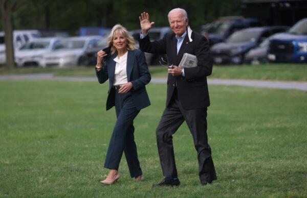 President Joe Biden and first lady Jill Biden walk to board Marine One for travel to the G-7 Summit in the UK from the Ellipse at the White House in Washington on June 9, 2021. (Leah Millis/Reuter)