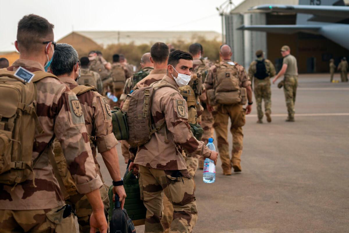 French Barkhane force soldiers who wrapped up a four-month tour of duty in the Sahel board a US Air Force C130 transport plane, leave their base in Gao, Mali, on June 9, 2021. (Jerome Delay/AP Photo)