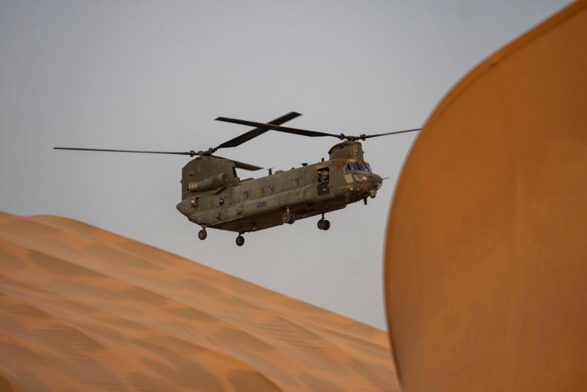 A British Royal Air Force transport helicopter hoovers over the tarmac of Barkhane Operation base in Gao, Mali, on June 7, 2021. (Jerome Delay/AP Photo)