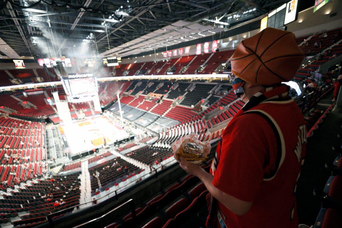 Brandon Bishop of Portland, a season ticket holder for 15 seasons, makes his way to his seat in section 310 before Round 1, Game 4 of the 2021 NBA Playoffs at Moda Center between the Portland Trail Blazers and the Denver Nuggets in Portland, Ore., on May 29, 2021. (Steph Chambers/Getty Images)