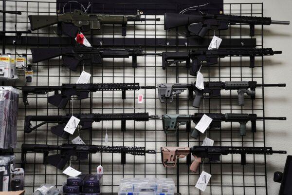  AR-15 style rifles are displayed for sale at Firearms Unknown, a gun store in Oceanside, Calif., on April 12, 2021. (Bing Guan/Reuters)