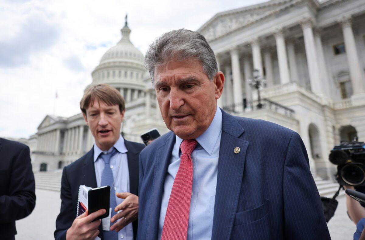 Sen. Joe Manchin (D-W.Va.) talks to reporters as he departs the U.S. Capitol after a vote in the Senate on Capitol Hill in Washington, on June 10, 2021. (Evelyn Hockstein/Reuters)