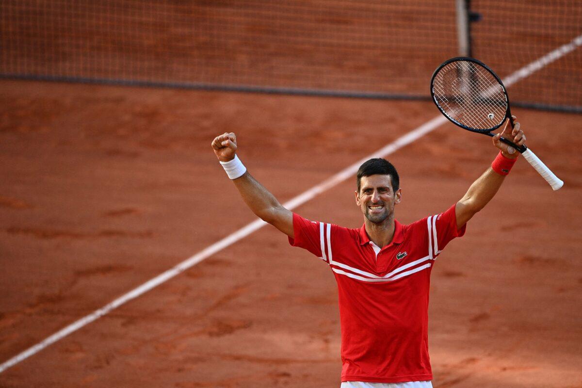 Serbia's Novak Djokovic celebrates after winning against Greece's Stefanos Tsitsipas at the end of their men's final tennis match on Day 15 of The Roland Garros 2021 French Open tennis tournament in Paris, France, on June 13, 2021. (Christophe Archambault/AFP via Getty Images)