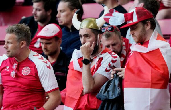 Fans of Denmark look dejected as Christian Eriksen (Not pictured) of Denmark receives medical treatment during the UEFA Euro 2020 Championship Group B match between Denmark and Finland in Copenhagen, Denmark, on June 12, 2021. (Martin Meissner - Pool/Getty Images)