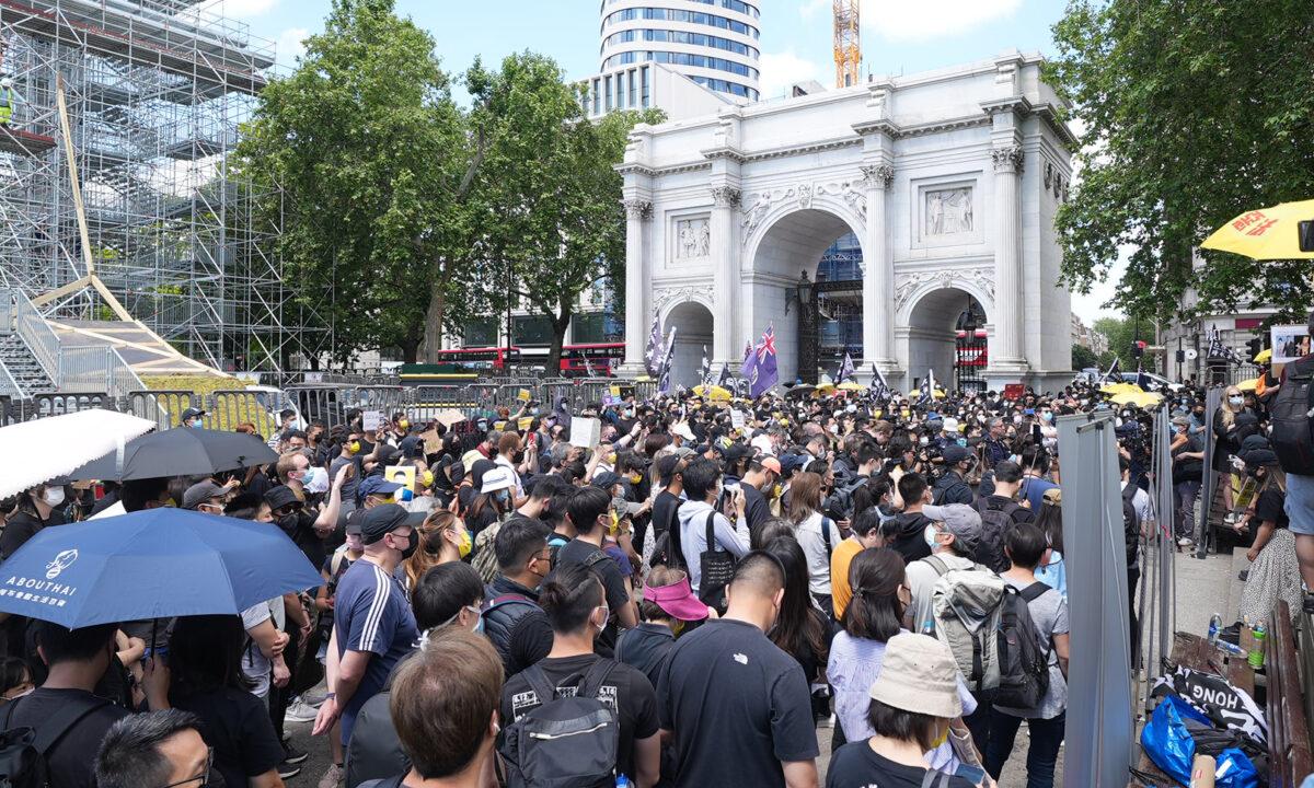 Supporters of Hong Kong's pro-democracy movement gather at a rally at Marble Arch ​in London on June 12, 2021. (Yanning Qi/The Epoch Times)