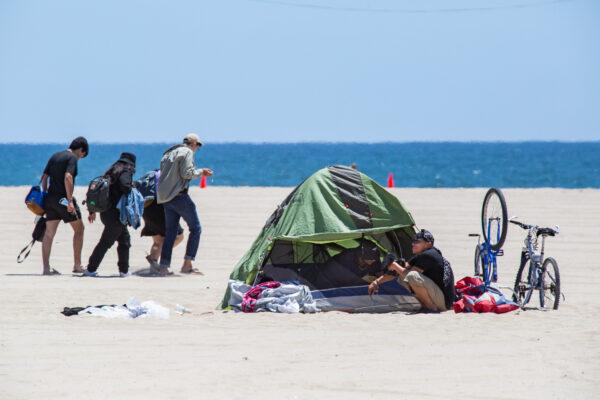 A homeless individual in Venice Beach, Calif., on June 8, 2021. (John Fredricks/The Epoch Times)