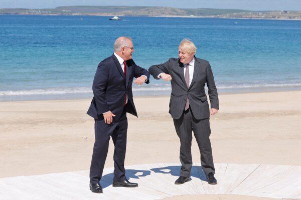 Britain's Prime Minister Boris Johnson welcomes Australia's Prime Minister Scott Morrison to the G7 summit in Carbis Bay, Cornwall on June 12, 2021. (LUDOVIC MARIN/AFP via Getty Images)