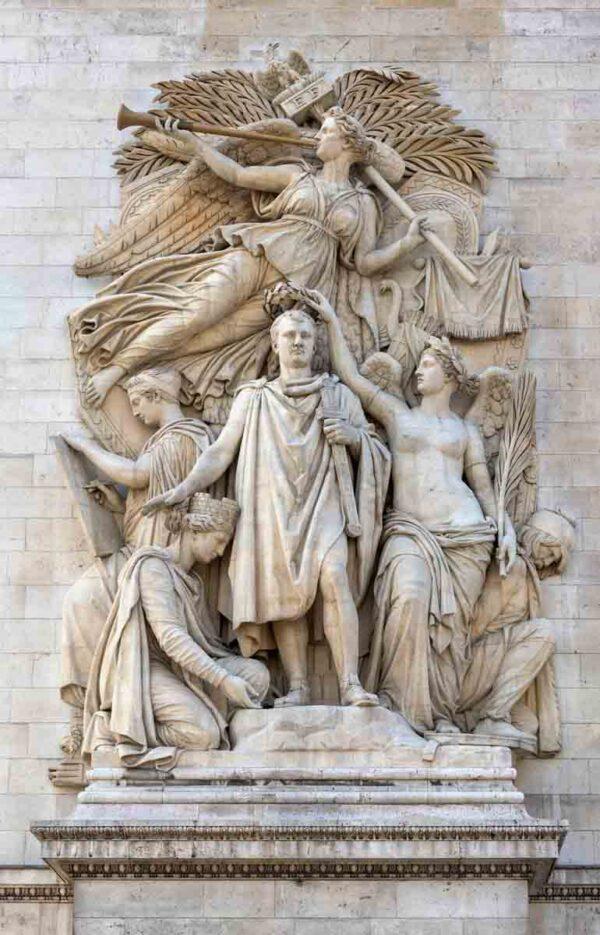 The “Triumph of Napoleon” by Jean-Pierre Cortot celebrates the 1810 Treaty of Vienna. In this sculpture, Bonaparte wears classical robes and stands proudly in the center. Victoria, the Genius of Victory over death, holds a laurel crown above his head; in her other hand is a palm branch. Above them all hovers the winged Genius of Fame, who announces Bonaparte’s victory with her trumpet, a motif not seen in antiquity but that emerged in the Renaissance period. In her other hand, Fame holds a battlestaff topped with the imperial eagle, which Bonaparte’s battalions would have carried into battle. (Public Domain)