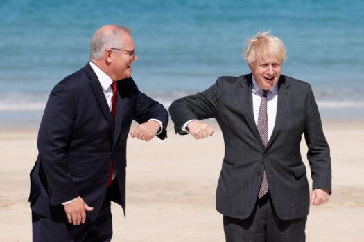 Britain's Prime Minister Boris Johnson greets Australia's Prime Minister Scott Morrison at the G7 summit in Carbis Bay on June 12, 2021, in Carbis Bay, Cornwall. (Adrian Dennis-WPA Pool/Getty Images)