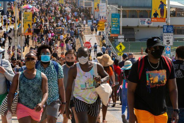 People crowd the Santa Monica Pier in Santa Monica, Calif., on May 29, 2021. (Damian Dovarganes/AP Photo)