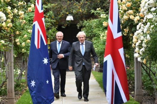 Britain's Prime Minister Boris Johnson (R) walks with Australian Prime Minister Scott Morrison after their meeting, in the garden of 10 Downing Street, in London, on June 15, 2021. (Dominic Lipinski/Pool via AP)