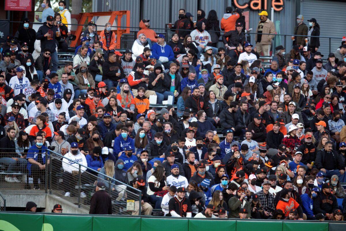 Fans sit in a vaccinated section of the stands during the fourth inning of a baseball game between the Los Angeles Dodgers and San Francisco Giants in San Francisco. Calif., on May 21, 2021. (D. Ross Cameron/AP Photo)