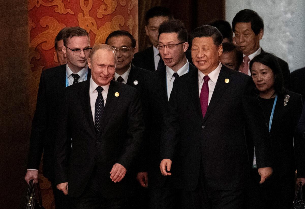 Russian President Vladimir Putin and Chinese leader Xi Jinping arrive for the welcome banquet for leaders attending the Belt and Road Forum at the Great Hall of the People in Beijing, China, on April 26, 2019. (Nicolas Asfouri/Pool/Getty Images)