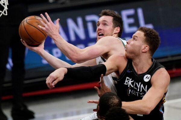 Milwaukee Bucks guard Pat Connaughton (24) reacts after he was fouled by Brooklyn Nets forward Blake Griffin while going up for a layup during the first half of Game 5 of a second-round NBA basketball playoff series in New York, on June 15, 2021. (Kathy Willens/AP Photo)
