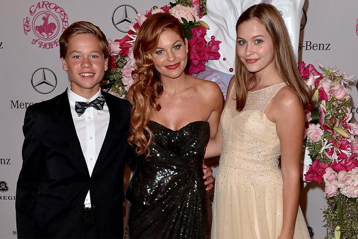 Kids Lev and Natasha with mom Candace Cameron Bure in Beverly Hills, California, on Oct. 11, 2014 (Kevin Winter/Getty Images)