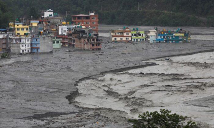 A general view shows houses hit by flash floods along the bank of Melamchi River in Sindhupalchok, Nepal, on June 16, 2021. (Navesh Chitrakar/Reuters)