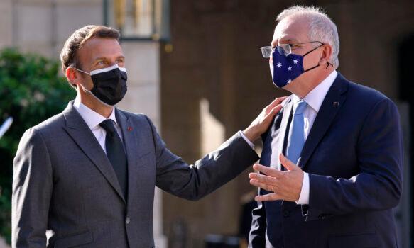 French President Emmanuel Macron (L) greets Australia’s Prime Minister Scott Morrison at the Elysee Palace in Paris on June 15, 2021. (Thomas Samso /AFP via Getty Images)