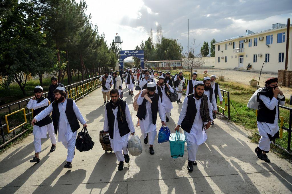 Taliban prisoners walk as they are in the process of being potentially released from Pul-e-Charkhi prison, on the outskirts of Kabul, Afghanistan, on July 31, 2020. Afghan President Ashraf Ghani on July 31 ordered the release of 500 Taliban prisoners as part of a new cease-fire that could lead to long-delayed peace talks. (Wakil Kohsar/AFP via Getty Images)