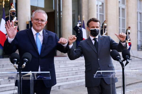 French President Emmanuel Macron (R) and Australian Prime Minister Scott Morrison answer the press prior to a working diner at the Elysee Palace in Paris on June 15, 2021. (Thomas Samson/AFP via Getty Images)