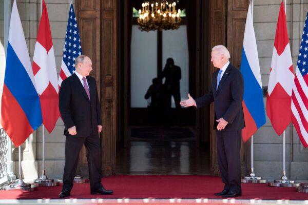 President Joe Biden prepares to shake hands with Russian President Vladimir Putin prior to the US-Russia summit at the Villa La Grange, in Geneva on June 16, 2021. (Brendan Smialowski/AFP)