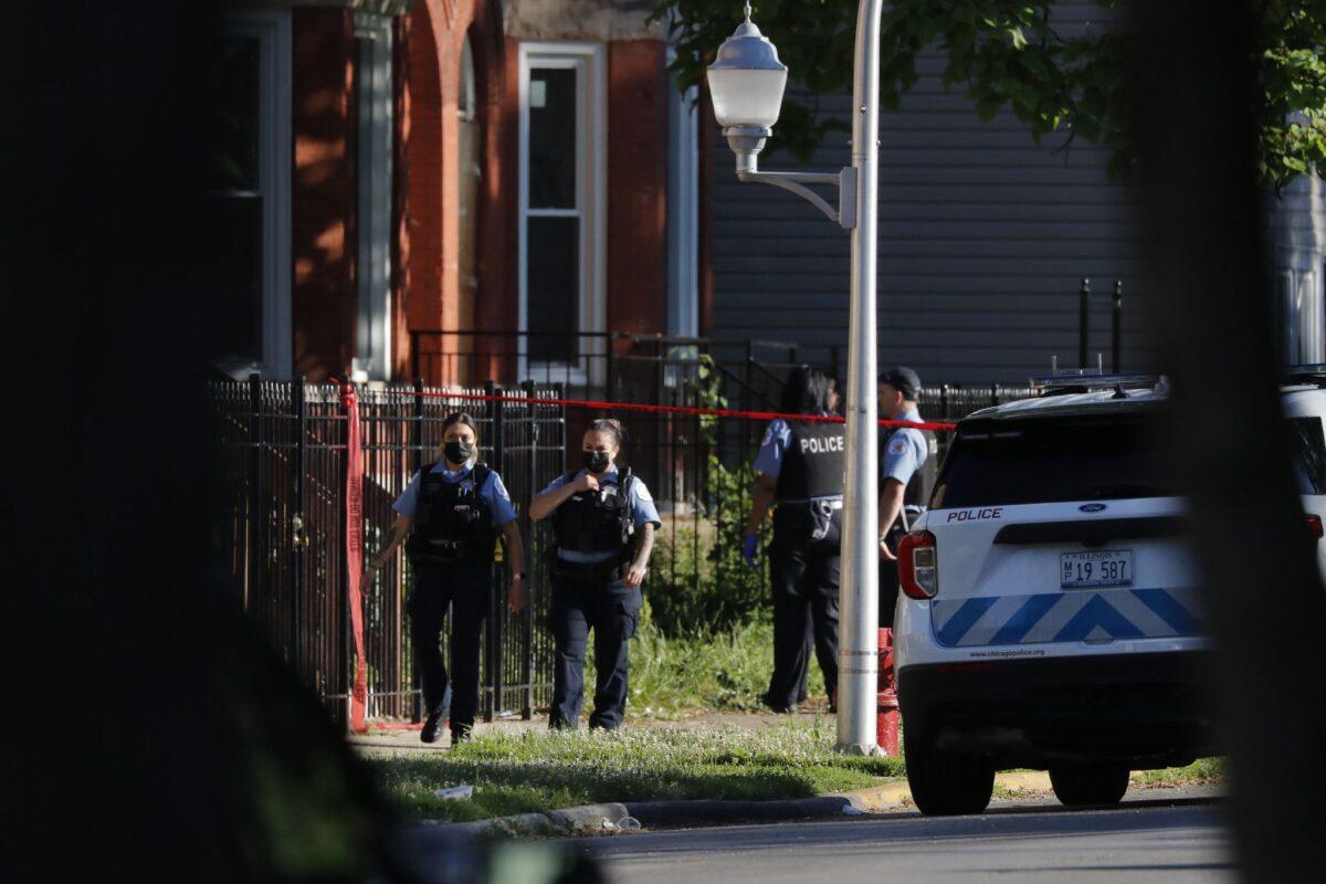 Chicago police work at the scene of a mass shooting in a file photo (Jose M. Osorio/Chicago Tribune/TNS)