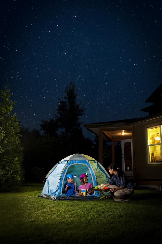 Get creative with your stay-cation 'lodging': Try turning your home into a hotel room, or pitching a tent in the backyard. (RonTech3000/Shutterstock)